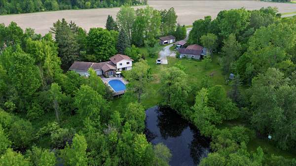 11.5 Acres of Recreational Land with Home for Sale in Lupton, Michigan