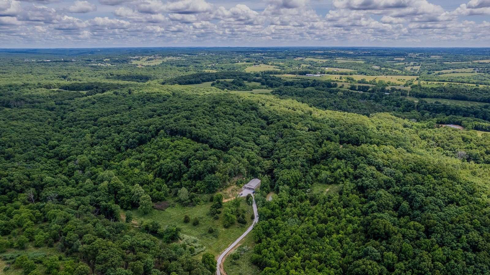 75 Acres of Recreational Land with Home for Sale in Highlandville, Missouri