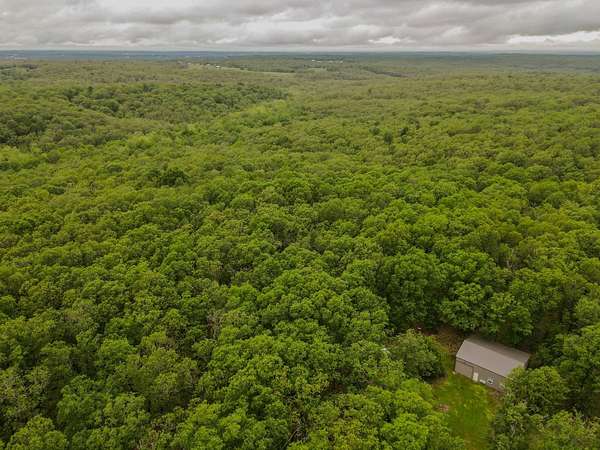 178 Acres of Recreational Land with Home for Sale in Long Lane, Missouri
