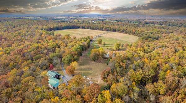 313 Acres of Land with Home for Sale in Long Lane, Missouri