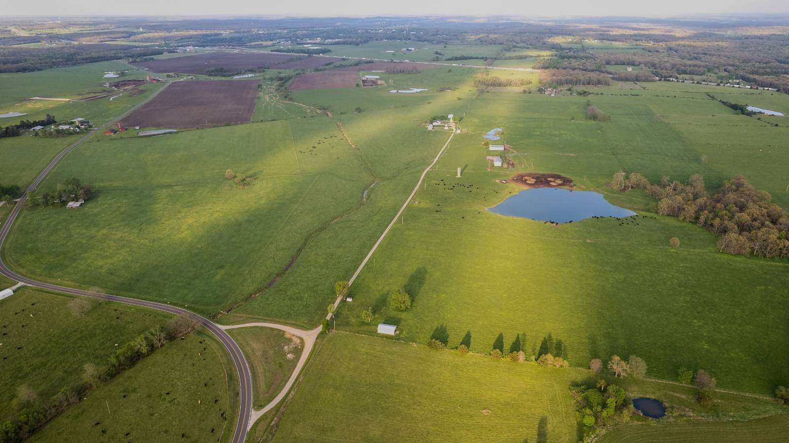 194 Acres of Agricultural Land with Home for Sale in Conway, Missouri