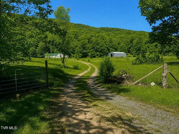 74 Acres of Agricultural Land with Home for Sale in Surgoinsville, Tennessee