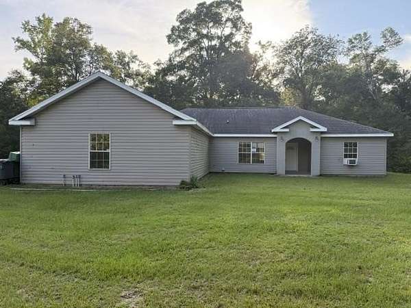 5.56 Acres of Land with Home for Sale in Crawfordville, Florida