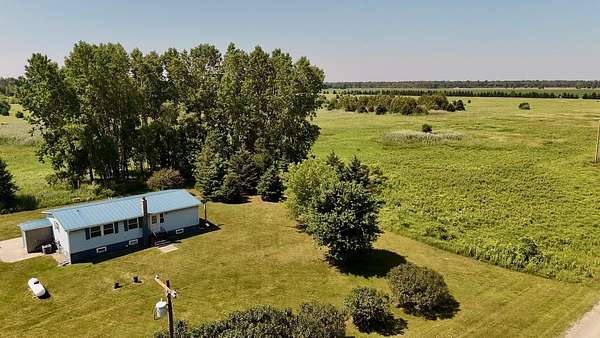 93.1 Acres of Recreational Land with Home for Sale in Turner, Michigan