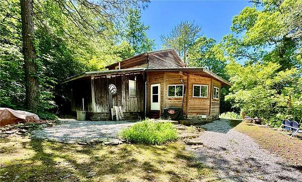 100 Acres of Recreational Land with Home for Sale in Witter, Arkansas