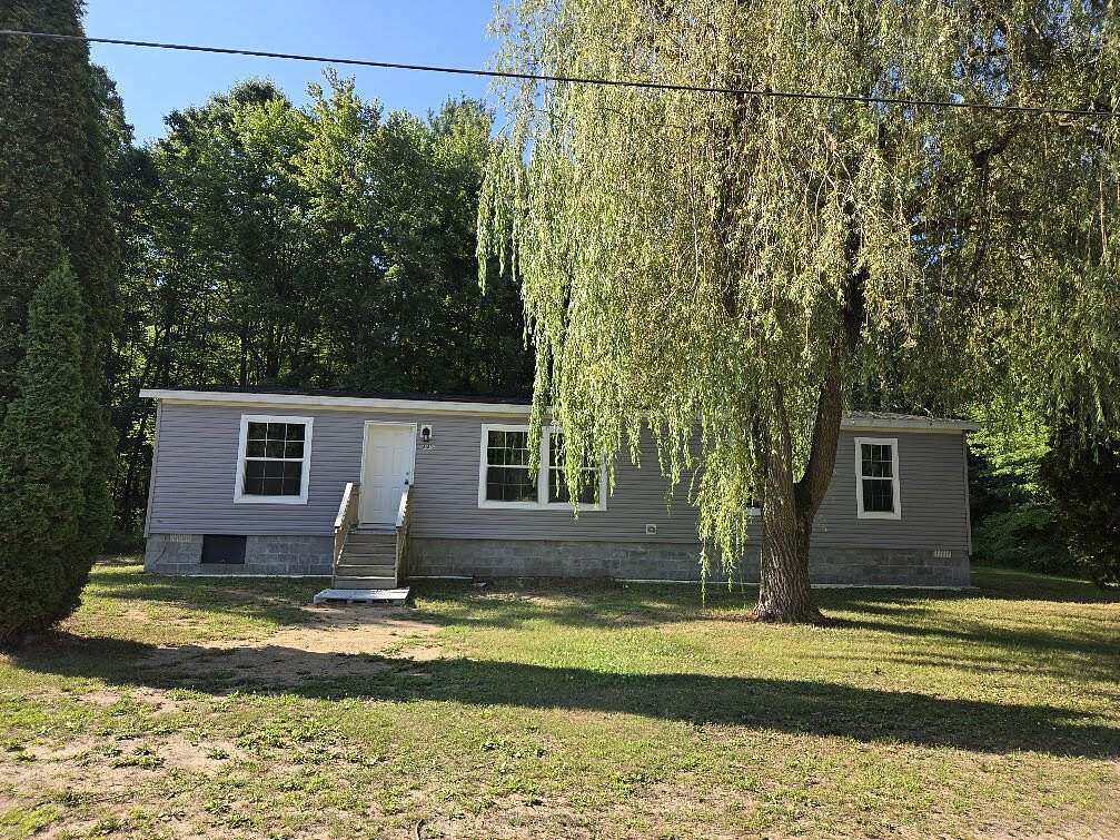 12.4 Acres of Recreational Land with Home for Sale in White Cloud, Michigan