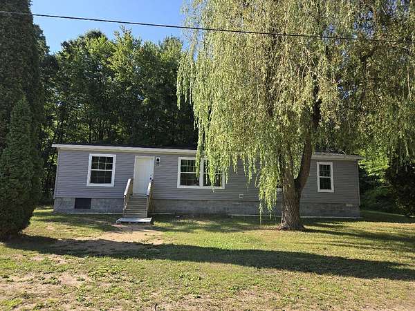 12.4 Acres of Recreational Land with Home for Sale in White Cloud, Michigan