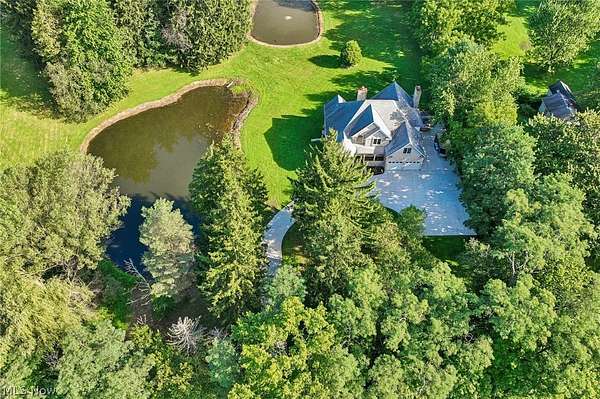 4.83 Acres of Land with Home for Sale in Norton, Ohio