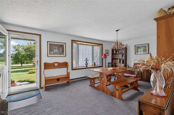 6.4 Acres of Land with Home for Auction in Hadley, Pennsylvania