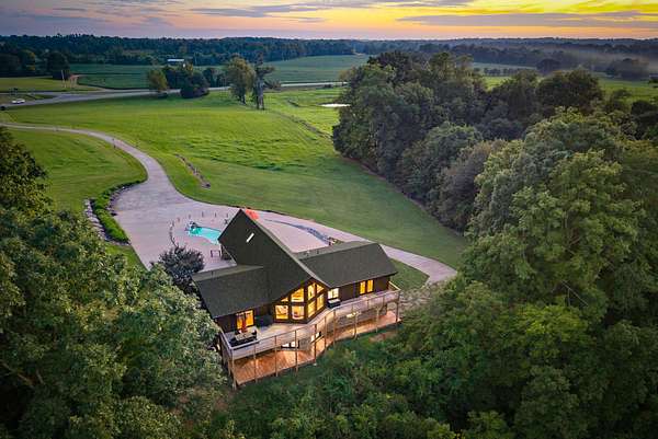 10.2 Acres of Land with Home for Sale in Adams, Tennessee