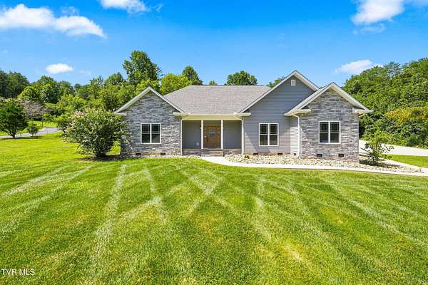 5.89 Acres of Land with Home for Sale in Strawberry Plains, Tennessee