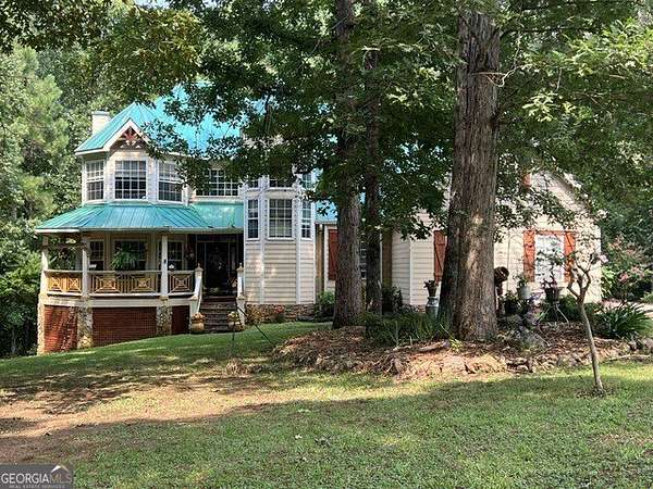 5.66 Acres of Land with Home for Sale in Locust Grove, Georgia