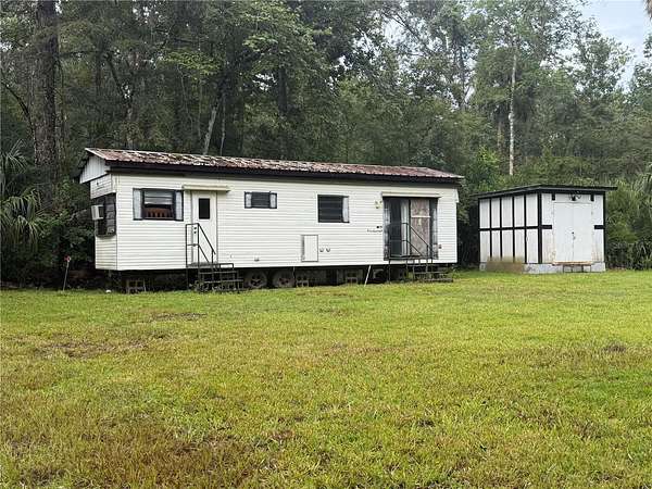 1.8 Acres of Land with Home for Sale in Inglis, Florida