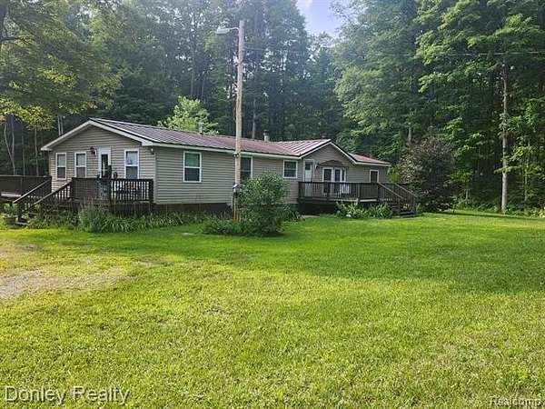 10 Acres of Recreational Land with Home for Sale in Coldsprings Township, Michigan