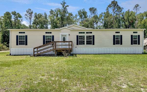 14.3 Acres of Land with Home for Sale in Live Oak, Florida