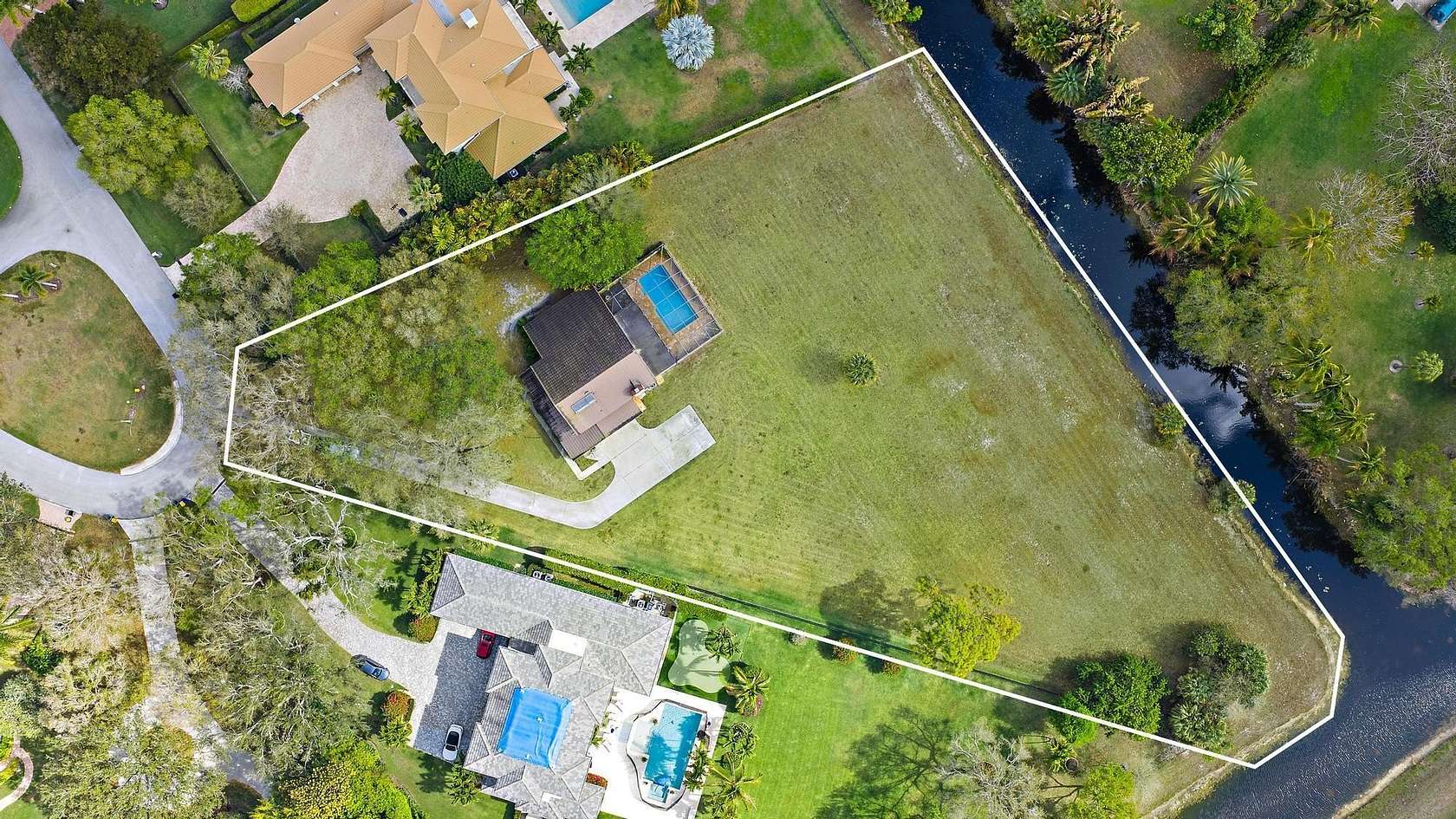 1.56 Acres of Land with Home for Sale in Palm Beach Gardens, Florida