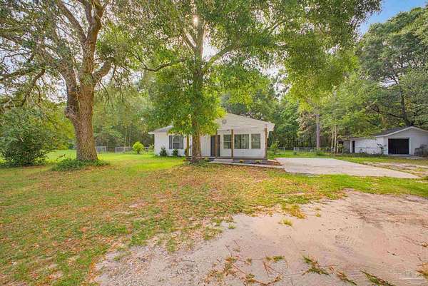 1.67 Acres of Land with Home for Sale in Pace, Florida