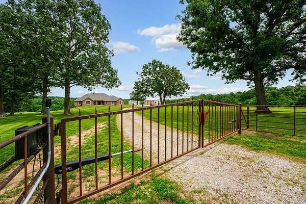 62.5 Acres of Recreational Land with Home for Sale in Marshfield, Missouri