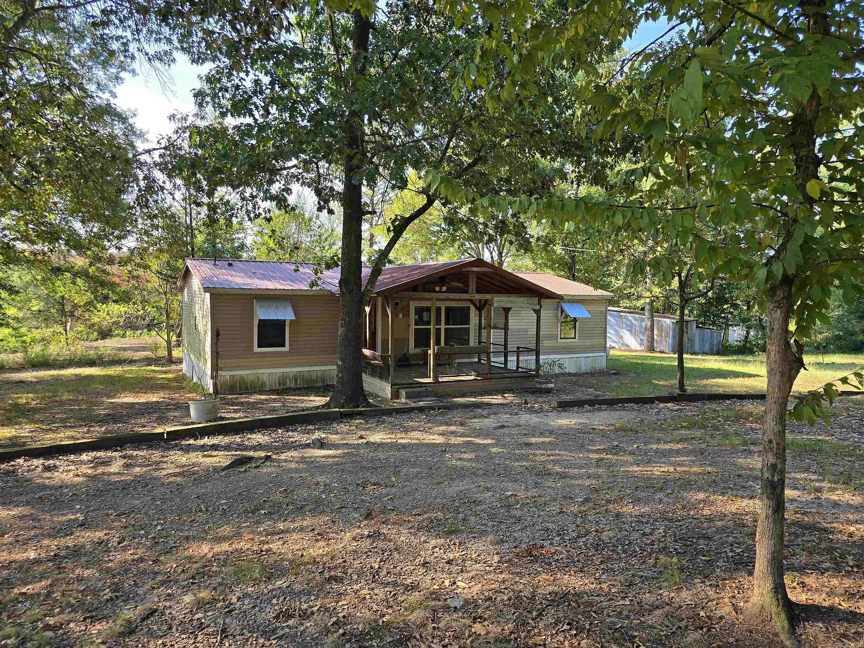 8.68 Acres of Land with Home for Sale in Grannis, Arkansas