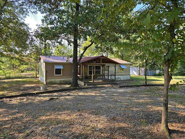 8.68 Acres of Land with Home for Sale in Grannis, Arkansas