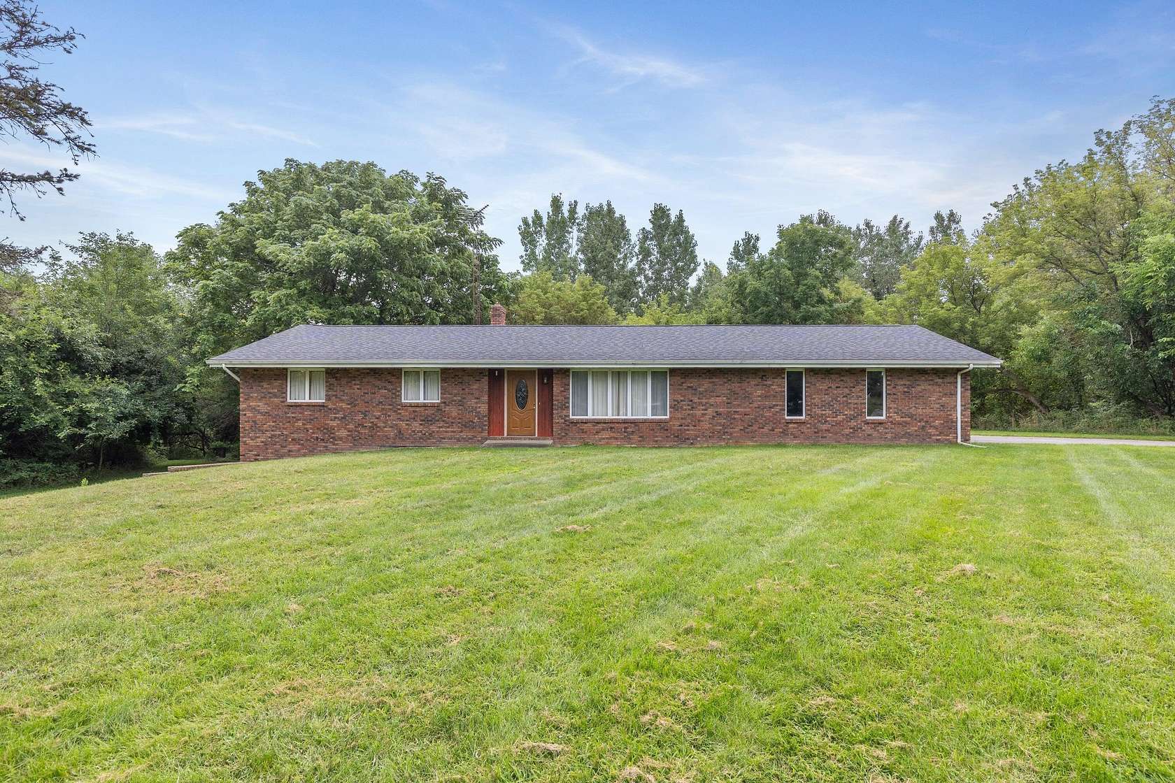 5 Acres of Land with Home for Sale in Eau Claire, Michigan