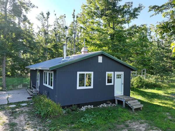 2 Acres of Land with Home for Sale in Elmira, Michigan