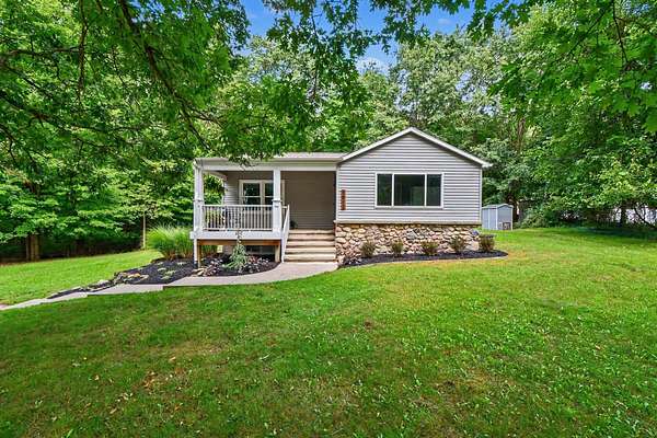 2 Acres of Land with Home for Sale in Alto, Michigan