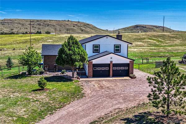 12.3 Acres of Land with Home for Sale in Larkspur, Colorado
