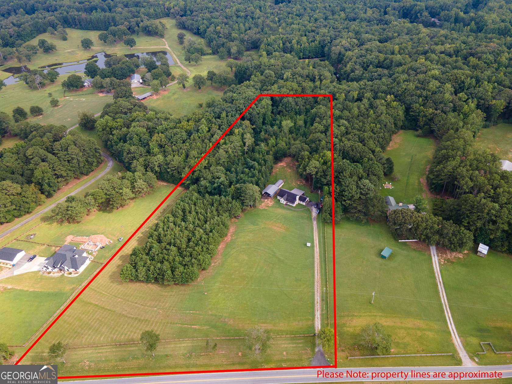 7.47 Acres of Land with Home for Sale in Grantville, Georgia