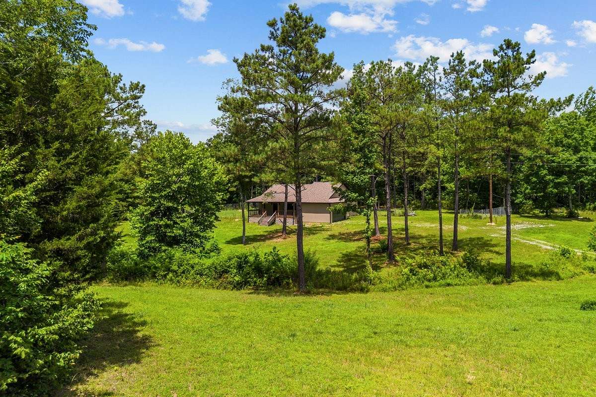 5 Acres of Land with Home for Sale in Holladay, Tennessee