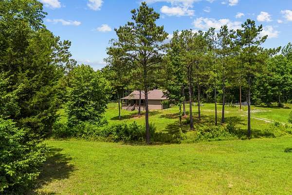 5 Acres of Land with Home for Sale in Holladay, Tennessee