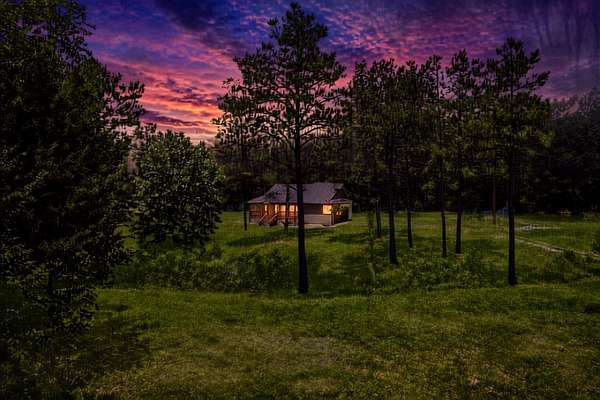 5 Acres of Land with Home for Sale in Holladay, Tennessee