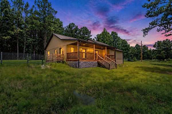 5 Acres of Land with Home for Sale in Holladay, Tennessee