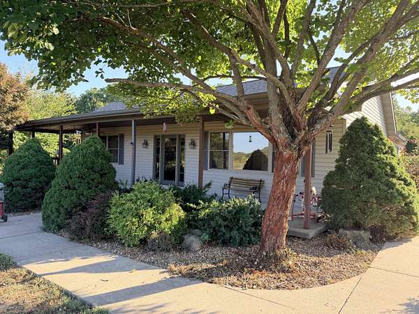 10.2 Acres of Land with Home for Sale in Humansville, Missouri