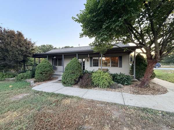 10.2 Acres of Land with Home for Sale in Humansville, Missouri