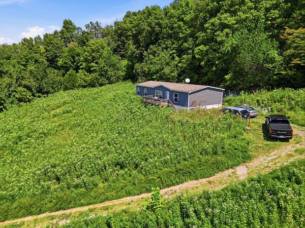 12.9 Acres of Land with Home for Sale in Dixon Springs, Tennessee
