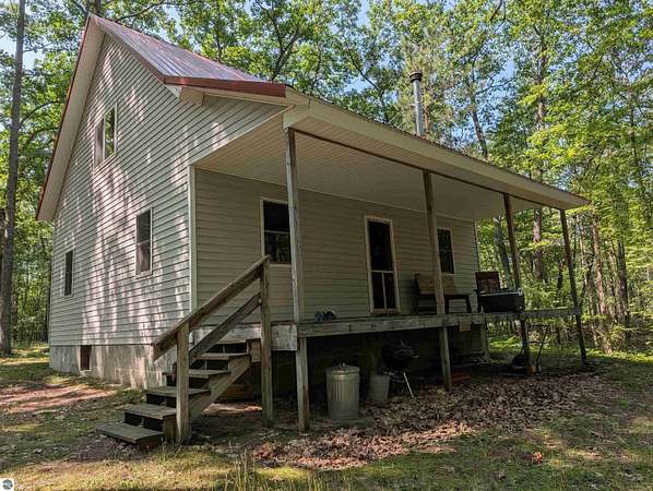 10 Acres of Land with Home for Sale in Barton City, Michigan