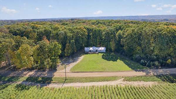 4 Acres of Land with Home for Sale in Walkerville, Michigan