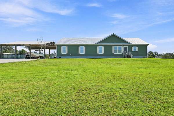 2 Acres of Land with Home for Sale in Okeechobee, Florida