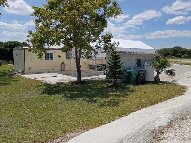 1.52 Acres of Land with Home for Sale in Okeechobee, Florida