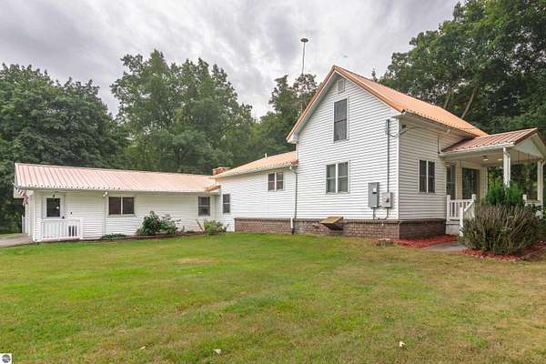11.9 Acres of Recreational Land with Home for Sale in Riverdale, Michigan