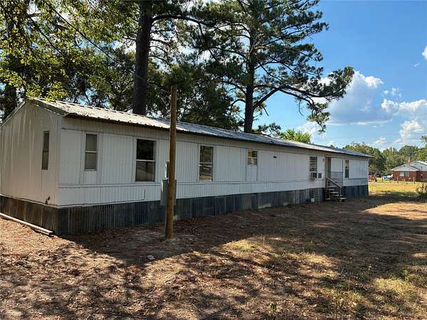 1.7 Acres of Land with Home for Sale in Elkhart, Texas