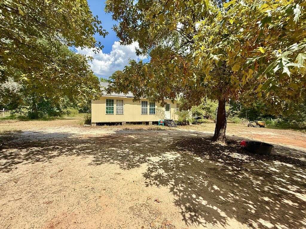5.89 Acres of Land with Home for Sale in Elkhart, Texas
