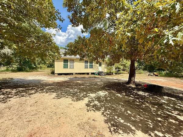 5.89 Acres of Land with Home for Sale in Elkhart, Texas