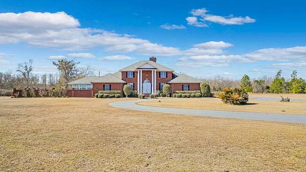 14.8 Acres of Land with Home for Sale in Altha, Florida