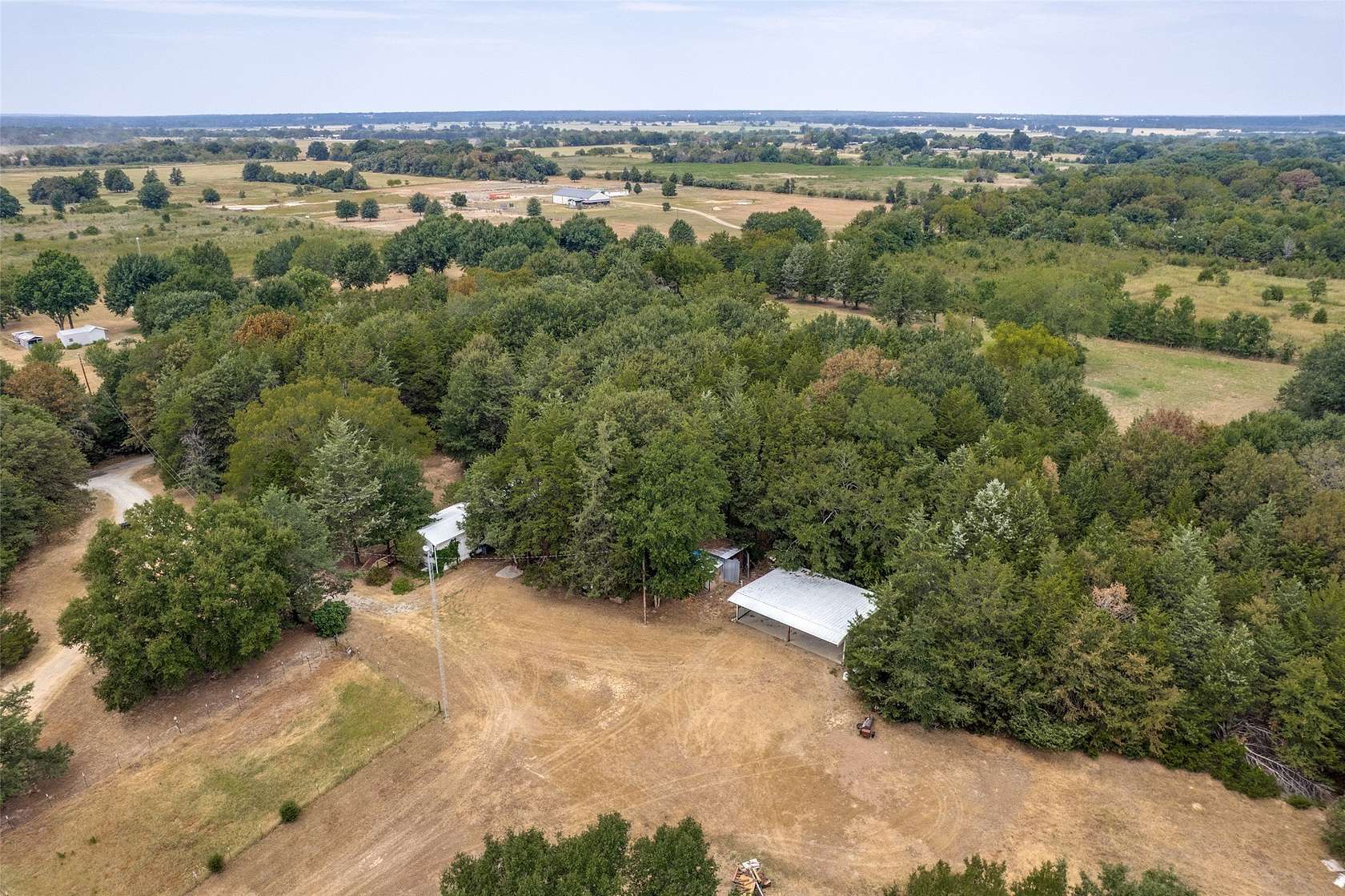 13.7 Acres of Land with Home for Sale in Ravenna, Texas