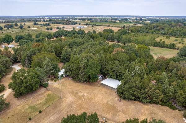 13.7 Acres of Land with Home for Sale in Ravenna, Texas