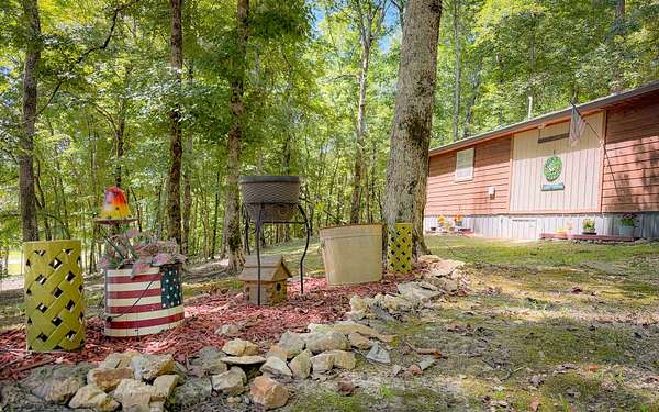 10.8 Acres of Recreational Land with Home for Sale in Linden, Tennessee