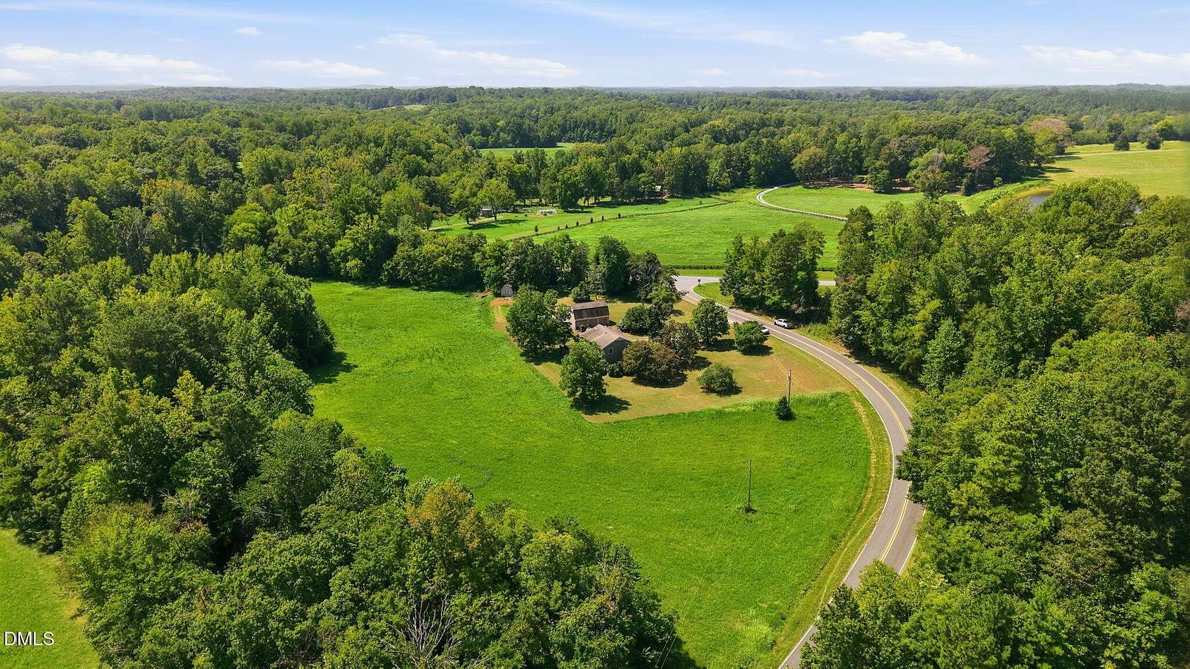6.69 Acres of Land with Home for Sale in Rougemont, North Carolina