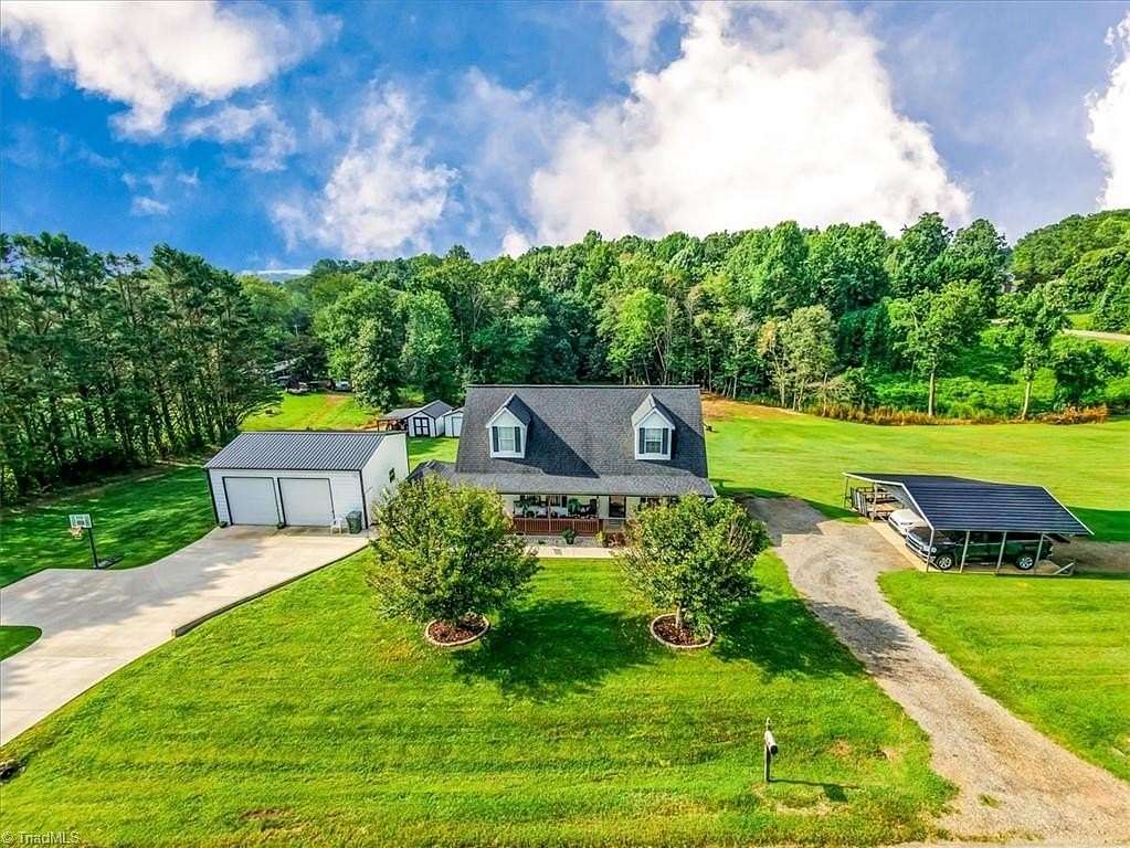 3.2 Acres of Land with Home for Sale in Roaring River, North Carolina